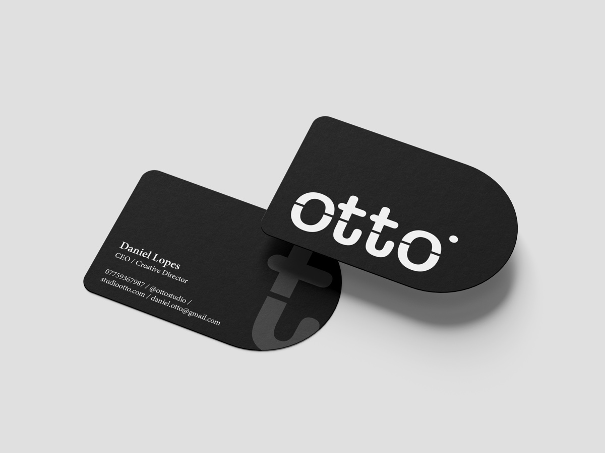 Otto Studio black business card mockup with white logo